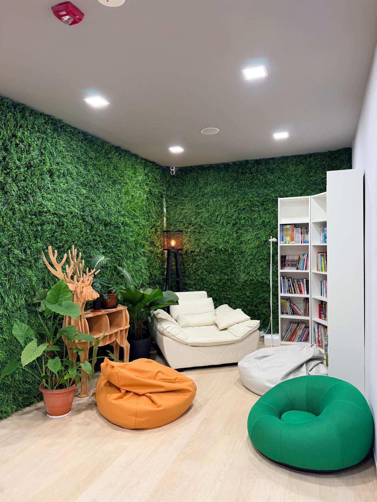 Our green-wall reading and lounge corner